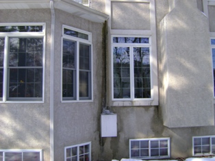 house with stucco moisture